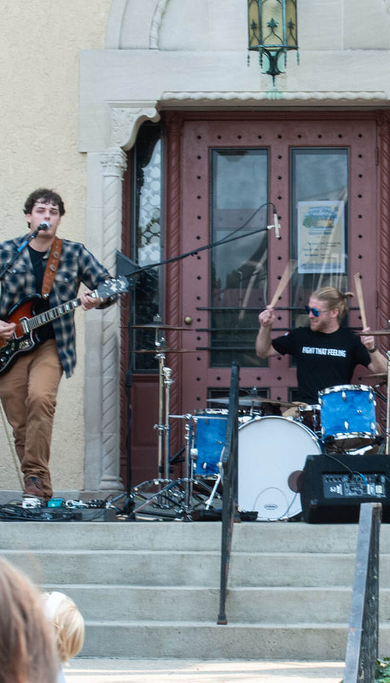 Seth Canan and the Carriers mid-performance on a porch in troy ohio
