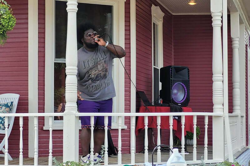 TINO performing hip-hop and rap music at the Troy Ohio Porch Fest