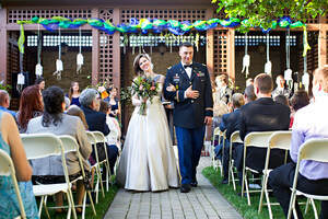 Wedding reception with decorated tables and ballroom setting at the historic Troy-Hayner Cultural Center in Troy, Ohio