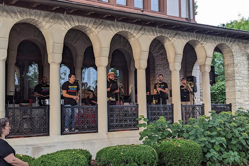The Dayton Salsa Band performs on the Troy Hayner Cultural Center Porch