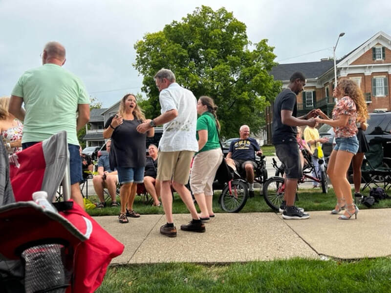 Crowd members dancing at Troy Porch Fest